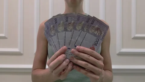 Woman counting the Malaysian ringgit - the currency of Malaysia, close-up. Stock Footage 283521388