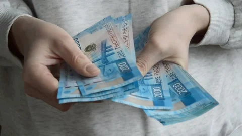 A woman counts banknotes with her hands. Russian money, rubles. 스톡 동영상 172538457