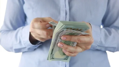 A woman counts a pack of dollars. Stock Footage 75048395