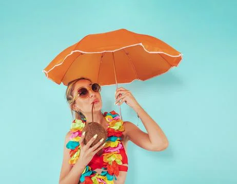 Woman cover herself from the sun radiation with an umbrella Stock Photos