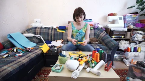 The Woman Creates Bright Multi-Colored Toys of Handmade Stock Footage 61154638