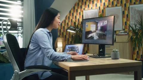 Woman creating 3D interior visualization 写真素材