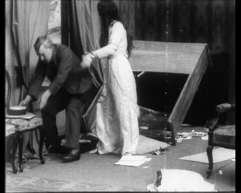 Woman cries after being molested by a young man, her father helps, UK 1914 Stock Footage 136673775