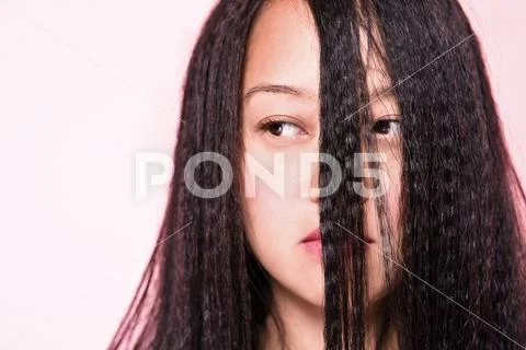 Woman With Crimped Hair Covering Face