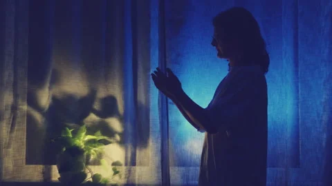 Woman crying at night dark window, low k... | Stock Video | Pond5