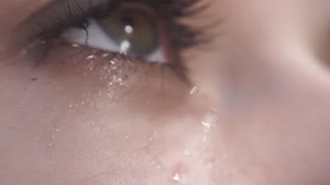 Woman crying with tears rolling down her face having allergy reaction on clue. Stock Footage 313815154