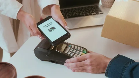 Woman customer using QR code payment via smartphone for paying at shop Видео 236259181