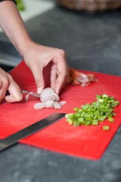 Woman cuts onion Stock Photos