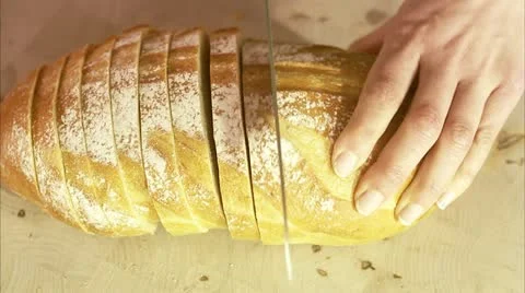 Woman cutting up bread Stock Footage 11292220