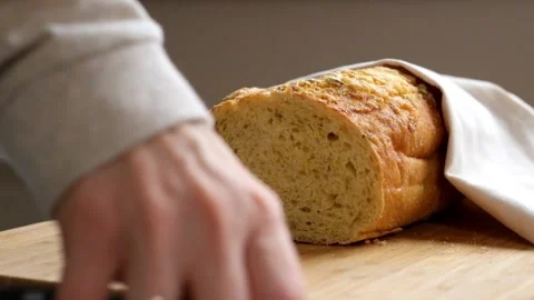 Woman Cutting Bread in the kitchen Stock Footage 88081460