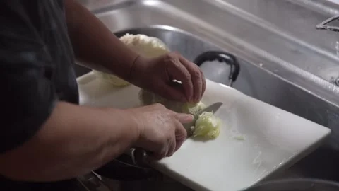 Woman cutting cabbage Stock Footage 277489509