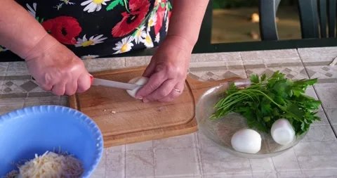 The woman is cutting eggs. Stock Footage 137710877