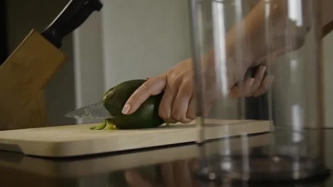 Woman cutting mango on the table Stock Footage 140600425