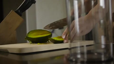 Woman cutting mango on the table 스톡 동영상 140600492