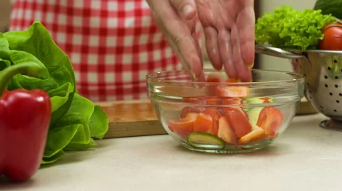 Woman Cutting Tomato, Adding It To The Vegetable Salad Stock Footage 46713203