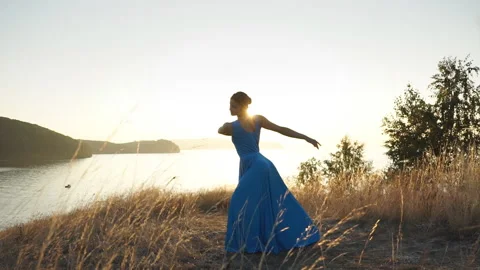 Woman dancer dancing on the edge of cliff Stock Footage 88025856