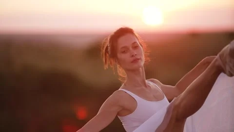 Woman dancer performs dance elements of classical ballet on nature Stock Footage 280059472