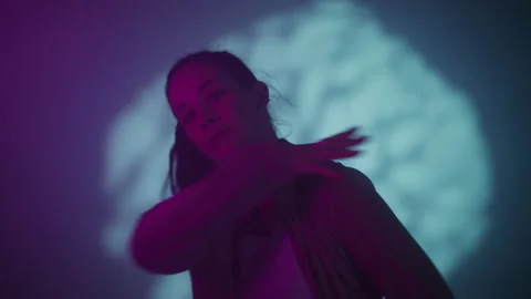 Woman Dancing and Looking At Camera in Studio Lighting 스톡 동영상 259140780