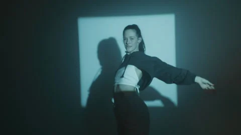 Woman Dancing and Looking At Camera Stock Footage 259143689