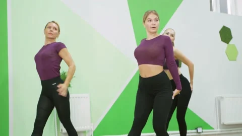 Woman dancing, beautiful dancer, athletic body, gym. trainer conducts group Video stock 220184452
