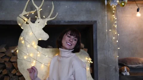 Woman dancing by Christmas decorations Video stock 219880153