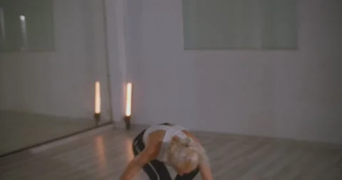 Woman dancing in dance studio practicing contemporary dance routine Stock Footage 229488298