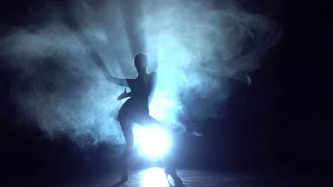 Woman dancing elements latin dance in the studio, silhouette. Slow motion Stock Footage