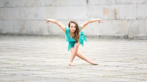 A woman dancing in an empty square Stock Photos