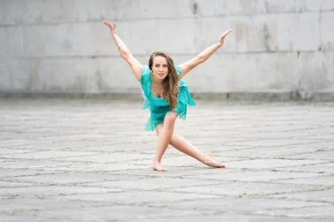 A woman dancing in an empty square Stock Photos