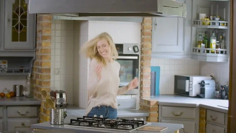 Woman dancing in the kitchen Stock Footage 111218803