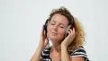Woman Dancing Listening to Music in Professional Headphones. Slow Motion. HD Footage