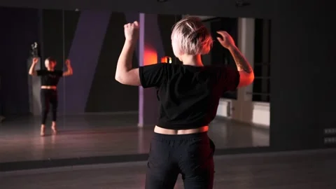 Woman dancing modern dance with elements of vogue and strip plastic Stock Footage 143106149