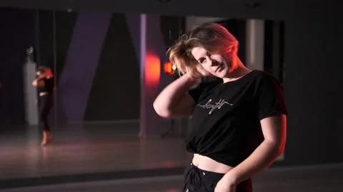 Woman dancing modern dance with elements of vogue and strip plastic Stock Footage 143106477