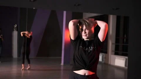 Woman dancing modern dance with elements of vogue and strip plastic Stock Footage 143106674