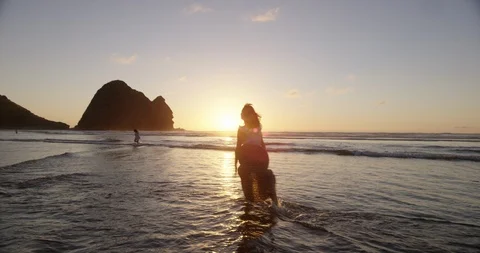 WOMAN DANCING IN THE OCEAN Stock Footage 125409364