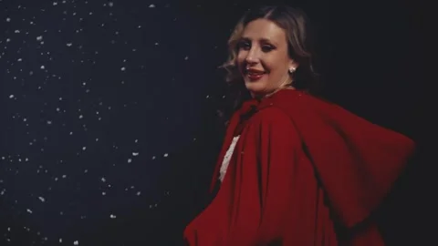 Woman dancing spinning under the snowfall, dark night forest winter nature snow Stock Footage 306970502