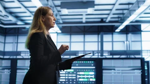 Woman in data center making sure rigs are functioning optimally Stock Footage 277648951