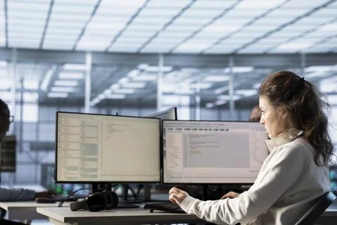 Woman in data center at PC checking servers bottlenecks leading to malfunctions 스톡 사진