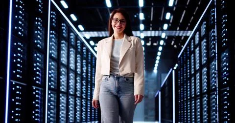 Woman Data Engineer Smiling After Setting Up Cloud Server Network 写真素材