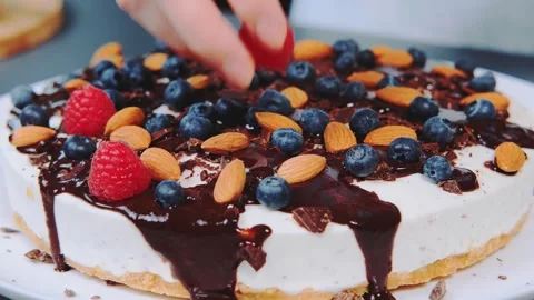 Woman Decorating Stracciatella Cake with Fresh Berries Indoors Stock Footage 342844054