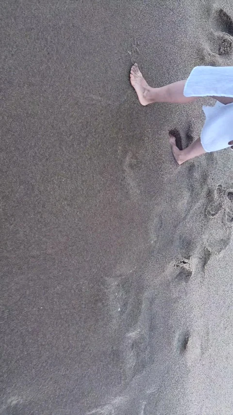 Woman deliberately throws a plastic bottle into the sea, illustrating ocean Stock Footage 338074812
