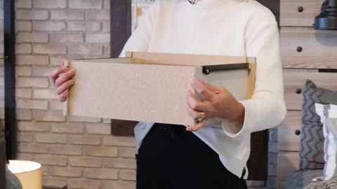 Woman Demonstrates Basic Dresser Drawer with Plastic Wheels and Metal Rails Stock Footage 308941388