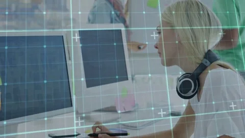 Woman designer leaning and using stylus, editing design on tablet, teal grid Stock Footage 331276320