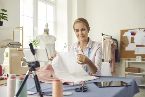 Woman designer record tutorial on smartphone 스톡 사진
