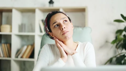 Woman designer thinks questioningly about difficult choice Stock Footage 237749187