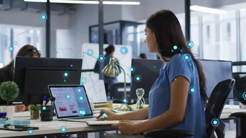 Woman at desk looking at laptop using mouse moving cup analyzing business data Stock Footage 333719973