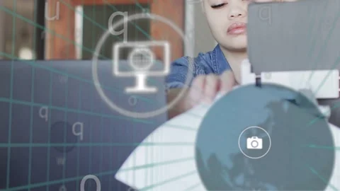 Woman at desk responding to tech notifications appearing on laptop, reaching and Stock Footage 334728882