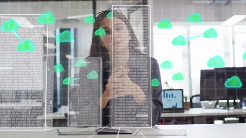 Woman at desk touching data block, starting towers and floating cloud icons, Stock Footage 333936827