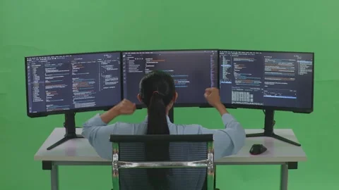 Woman Developer Celebrating And Dancing While Write Code With Multiple Computer Stock Footage 252564384