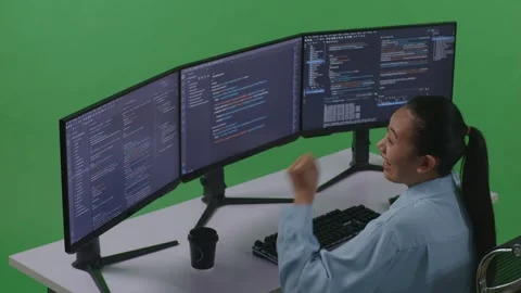 Woman Developer Celebrating While Write Code With Multiple Computer Screens Stock Footage 252577626